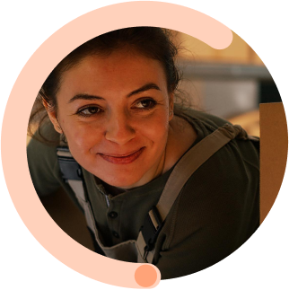 Professional woman in casual attire sharing company mission of simple, affordable, and ready-to-support business logistics solutions