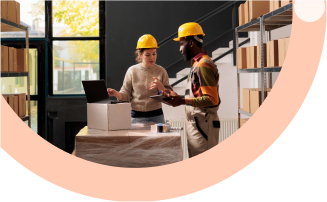 Make Smarter Decisions with Real-Time Data: Construction workers in yellow hard hats using tablets for real-time data analytics and inventory management