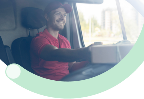People First: Delivery driver in vehicle using mobile device for customer-focused logistics operations prioritizing people in every business decision