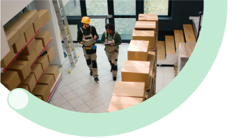 Easily Scale as Your Business Grows: Warehouse workers managing cardboard packages and inventory in distribution center