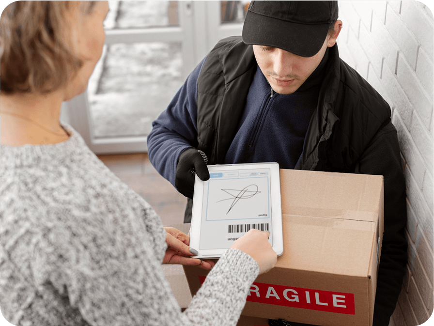 Professional delivery driver in black cap providing package delivery service to female customer with electronic proof of delivery and digital signature capture
