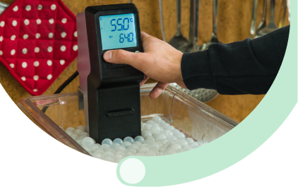 Cold Chain Management: Warehouse worker using tablet for temperature-controlled cold chain management and refrigerated food storage monitoring in distribution facility